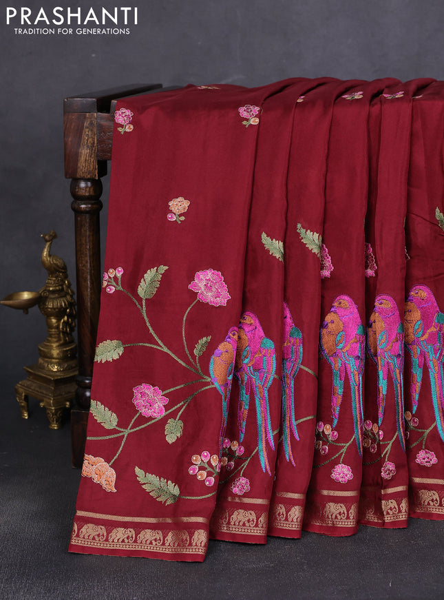 Semi crepe silk saree deep maroon with allover embroidery and elephant zari woven border