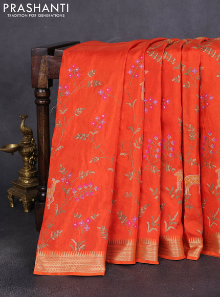 Semi crepe silk saree orange with allover convent embroidery and temple zari woven border