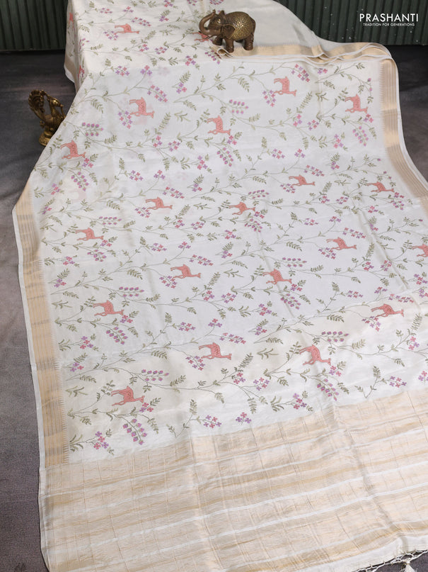 Semi crepe silk saree off white with allover convent embroidery and temple zari woven border