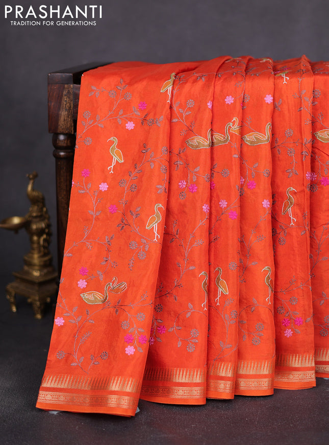 Semi crepe silk saree orange with allover convent embroidery and temple zari woven border
