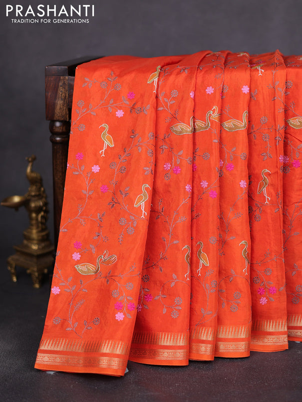 Semi crepe silk saree orange with allover convent embroidery and temple zari woven border