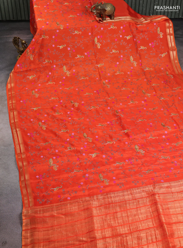 Semi crepe silk saree orange with allover convent embroidery and temple zari woven border