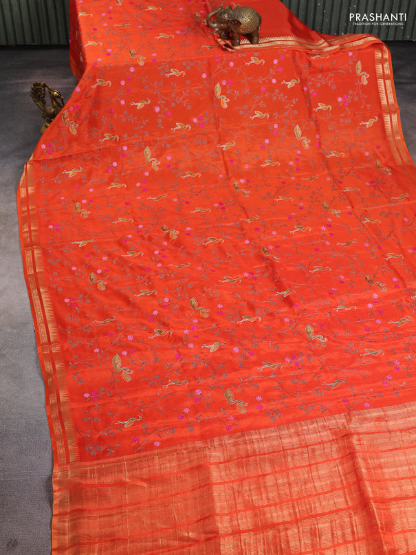 Semi crepe silk saree orange with allover convent embroidery and temple zari woven border