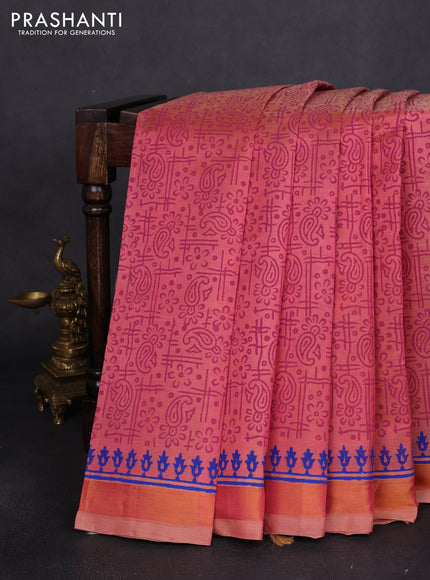 Silk cotton block printed saree dual shade of peach with allover prints and zari woven border