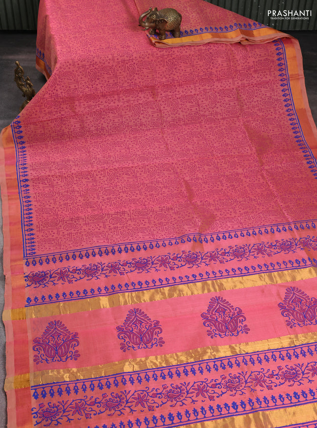 Silk cotton block printed saree dual shade of peach with allover prints and zari woven border
