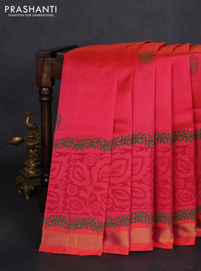Silk cotton block printed saree pinkish orange with prints and long printed zari woven border