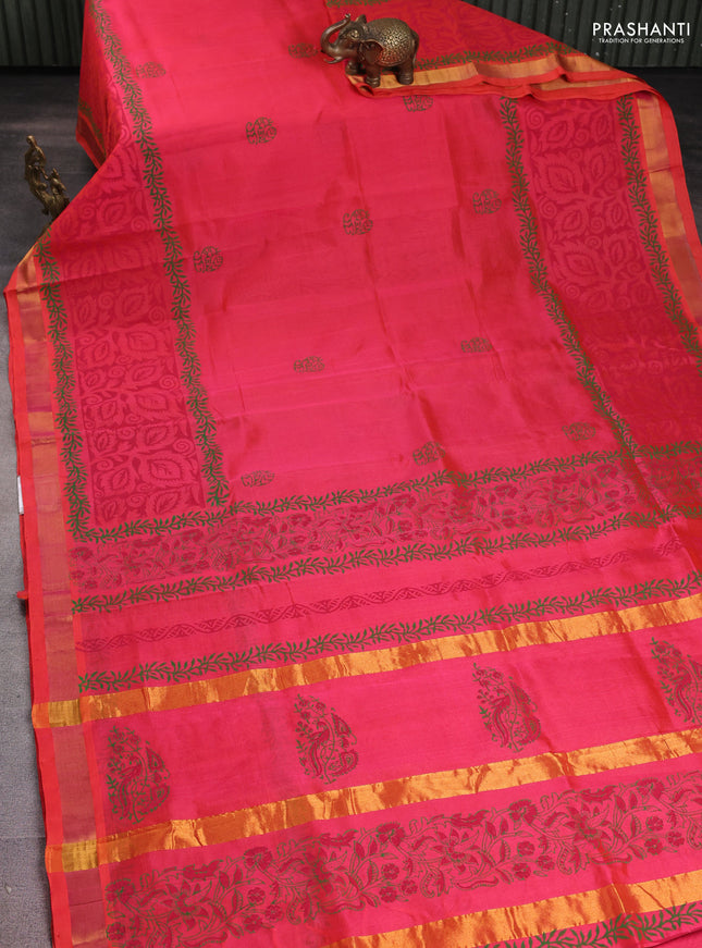 Silk cotton block printed saree pinkish orange with prints and long printed zari woven border