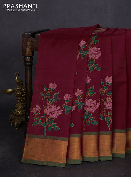 Silk cotton block printed saree maroon and green with floral prints and zari woven border