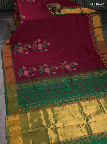 Silk cotton block printed saree maroon and green with floral prints and zari woven border