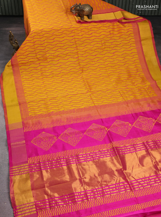 Silk cotton block printed saree mango yellow and pink with allover prints and zari woven border