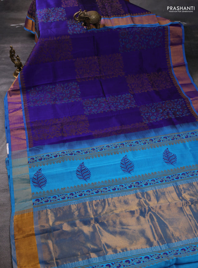 Silk cotton block printed saree blue and cs blue with allover prints and zari woven border