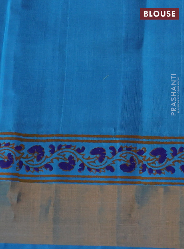 Silk cotton block printed saree blue and cs blue with allover prints and zari woven border