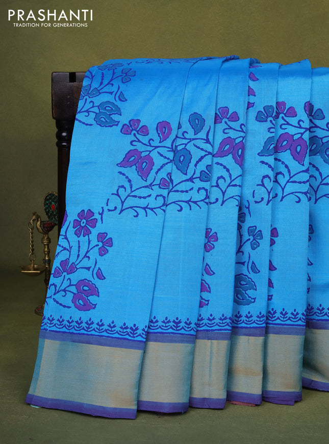 Silk cotton block printed saree light blue and blue with allover floral prints and zari woven border