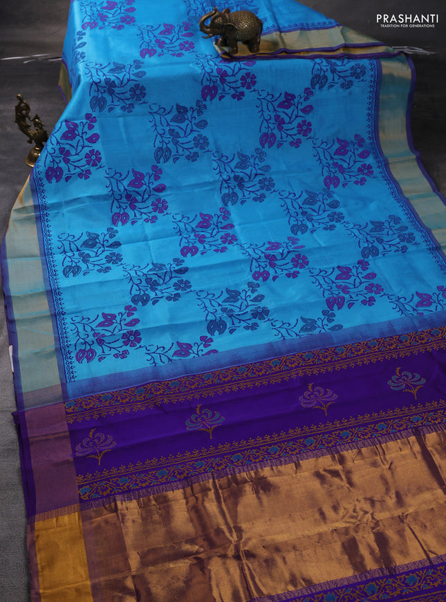 Silk cotton block printed saree light blue and blue with allover floral prints and zari woven border