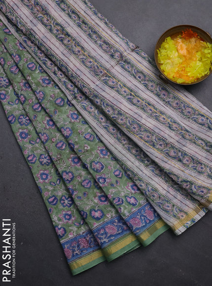 Chanderi bagru saree pastel green with allover floral prints and small zari woven border