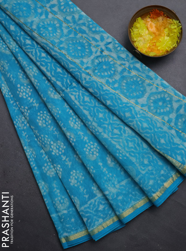 Chanderi bagru saree teal blue with allover dabu prints and small zari woven border