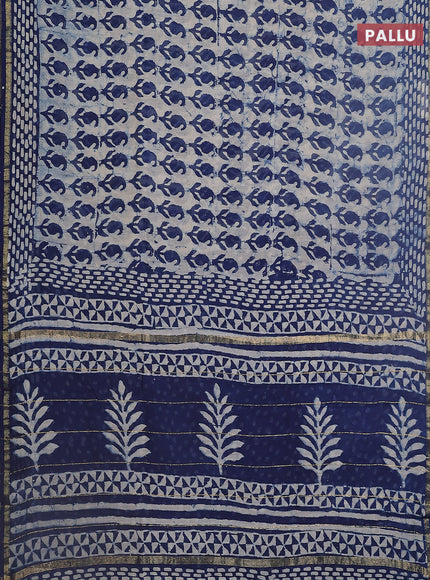 Chanderi bagru saree beige and blue with allover dabu prints and small zari woven border