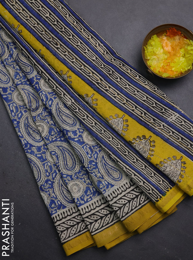 Chanderi bagru saree blue and yellow with allover paisley prints and small zari woven border