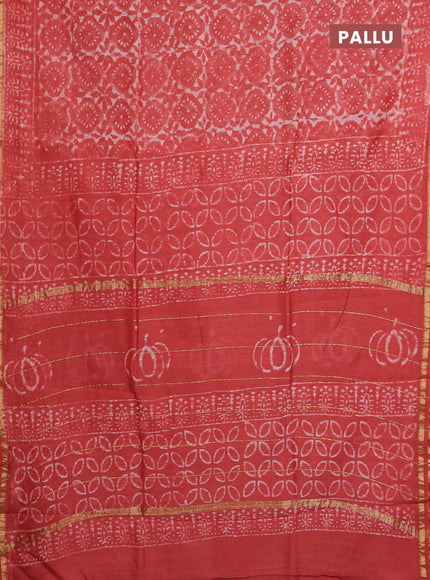 Chanderi bagru saree orange with allover dabu prints and small zari woven border