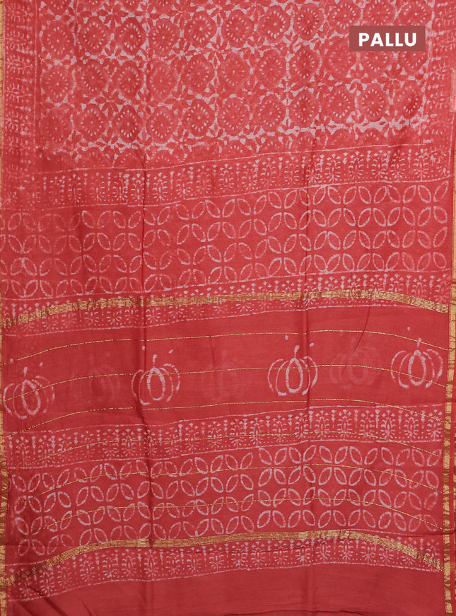 Chanderi bagru saree orange with allover dabu prints and small zari woven border