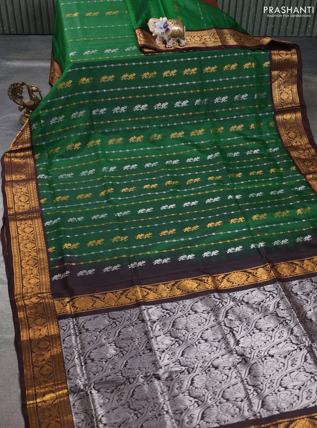 Pure uppada silk saree green and coffee brown with allover silver & gold zari weaves and annam zari woven border
