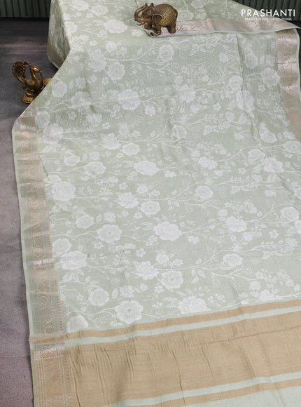 Mul chanderi saree pastel green with allover floral digital prints and zari woven border