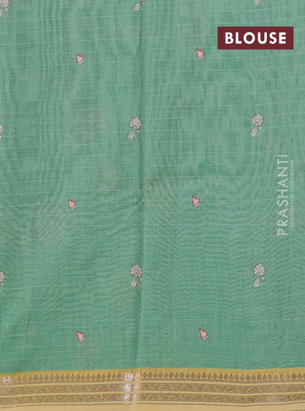 Mul chanderi saree teal green and sandal with allover floral digital prints and zari woven border