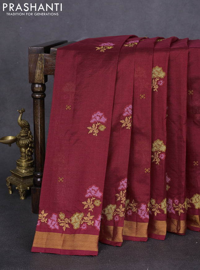 Silk cotton saree maroon with floral embriodery and zari woven border