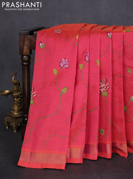 Silk cotton saree pinkish orange with allover floral embriodery and zari woven border