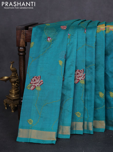 Silk cotton saree teal green with allover floral embriodery and zari woven border