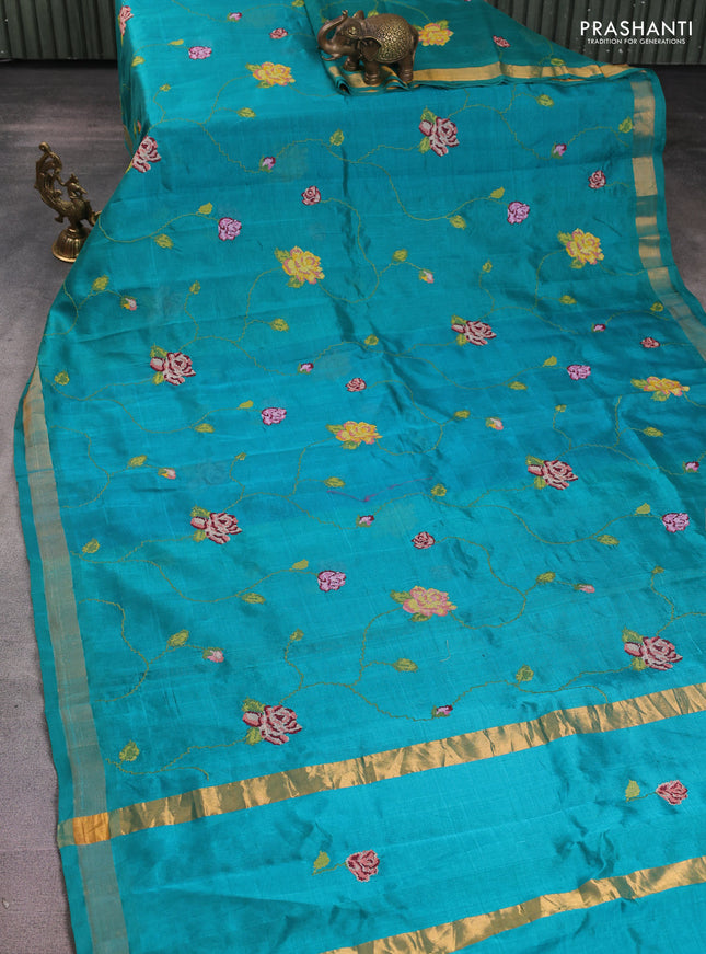 Silk cotton saree teal green with allover floral embriodery and zari woven border