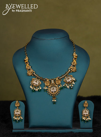 Green-Coffee brown kanchipuram silk saree with matching antique necklace