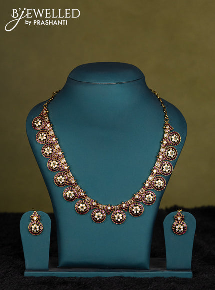 Green-Maroon kanchipuram silk saree with matching antique necklace
