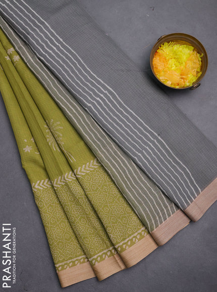 Kota silk cotton saree light green and grey with block prints and long printed border