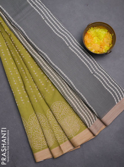 Kota silk cotton saree light green and grey with allover block prints and printed border