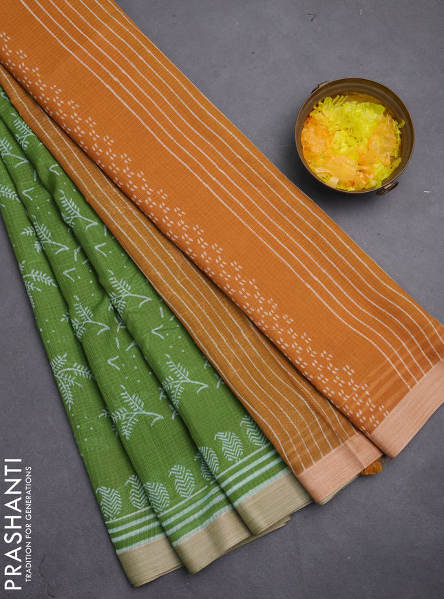 Kota silk cotton saree light green and dark mustard with allover block prints and simple border