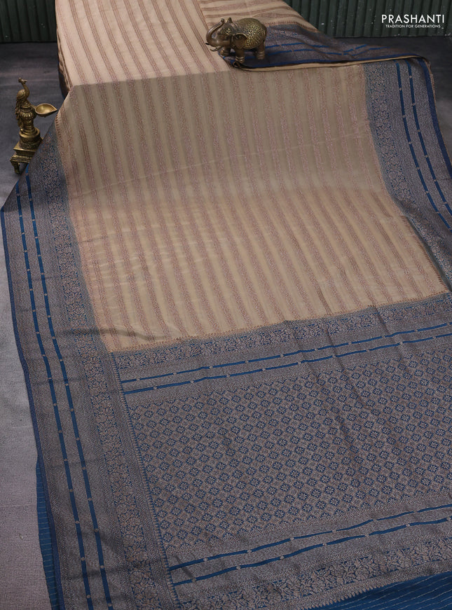 Banarasi semi crepe saree beige and peacock green with allover zari weaves and long zari woven border