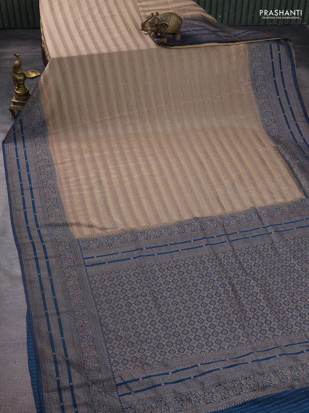 Banarasi semi crepe saree beige and peacock green with allover zari weaves and long zari woven border