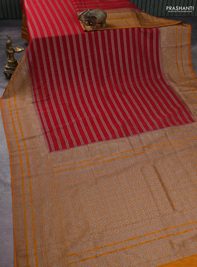 Banarasi semi crepe saree red and dark mustard with allover zari weaves and long zari woven border