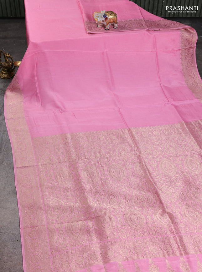 Dola silk saree light pink with plain body and zari woven border