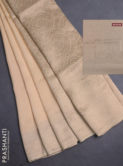 Dola silk saree cream with plain body and zari woven border