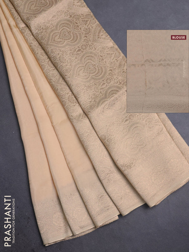 Dola silk saree cream with plain body and zari woven border