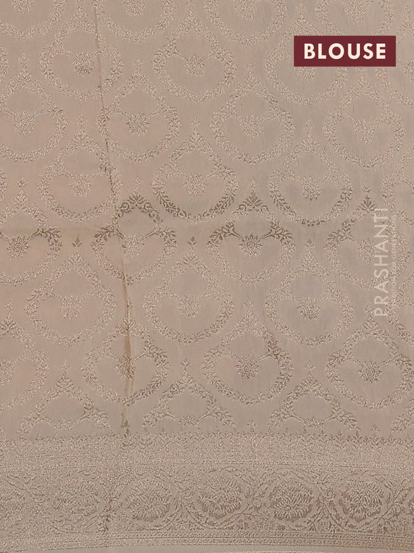 Dola silk saree cream with plain body and zari woven border