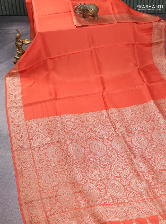 Dola silk saree orange with plain body and zari woven border