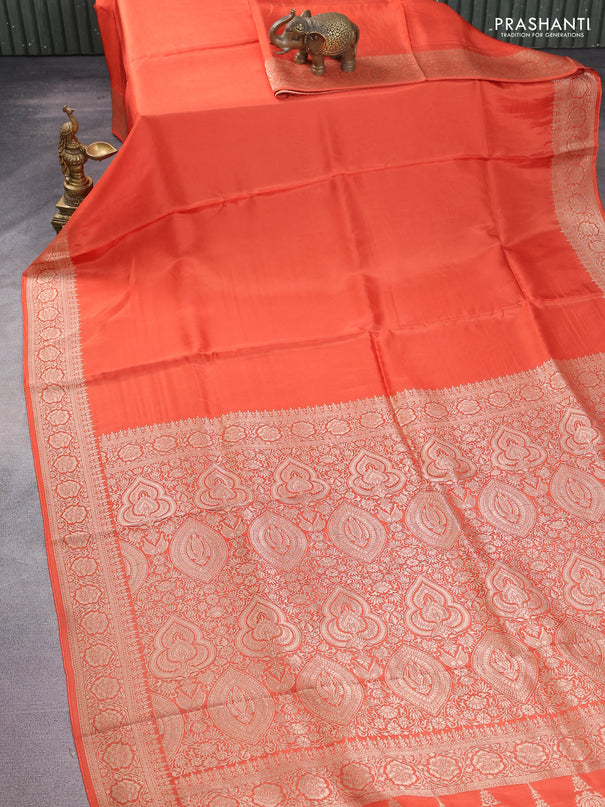 Dola silk saree orange with plain body and zari woven border