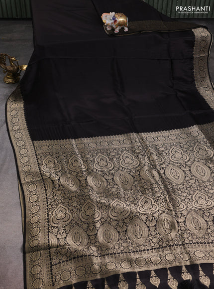 Dola silk saree black with plain body and zari woven border