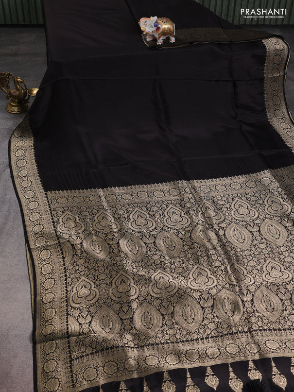 Dola silk saree black with plain body and zari woven border