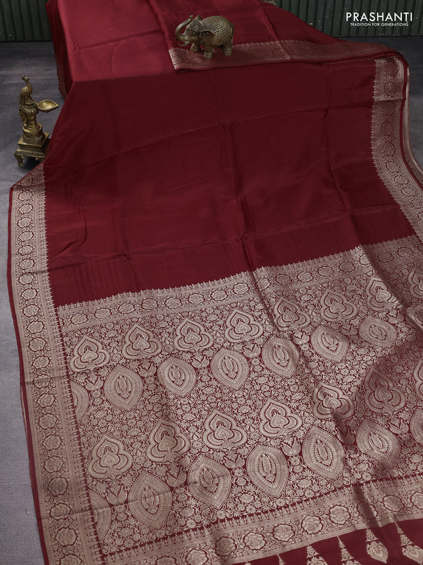 Dola silk saree maroon with plain body and zari woven border