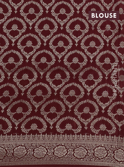 Dola silk saree maroon with plain body and zari woven border