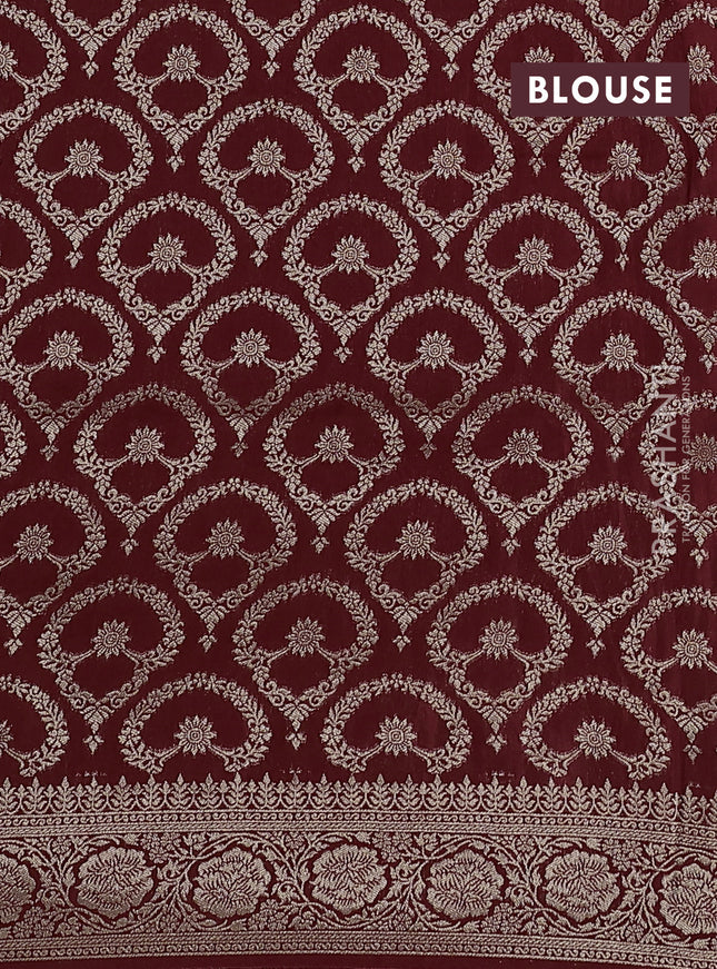 Dola silk saree maroon with plain body and zari woven border